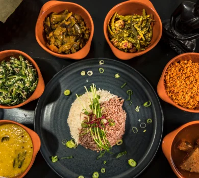Traditional Sri Lankan rice and curry platter with multiple side dishes