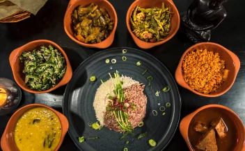 Traditional Sri Lankan rice and curry platter with multiple side dishes